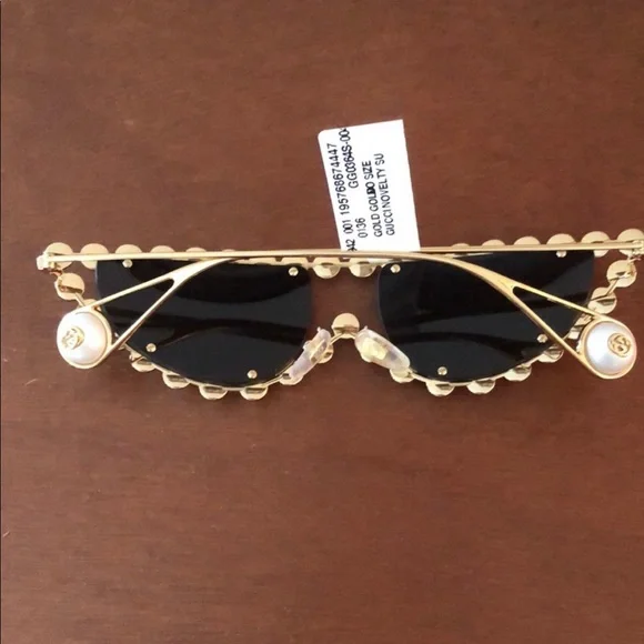 Gucci
​53MM Faux Pearl Cat Eye Sunglasses Gucci Rimless Metal Oval Sunglasses with Faux Pearls  main image 4